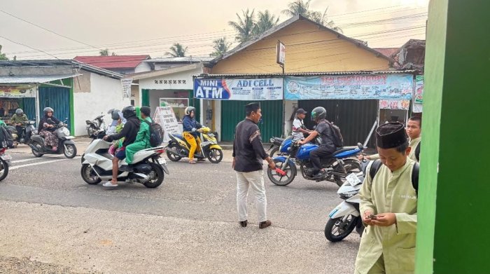 Erwansyah, Penjaga Keamanan MAN 2 Kota Jambi yang Setiap Pagi Bantu Atur Lalu Lintas